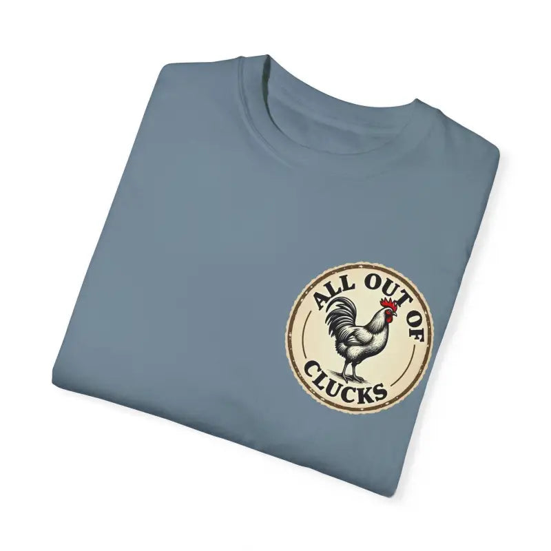 Folded blue t-shirt featuring a chicken graphic from All Out of Clucks Mens Collection