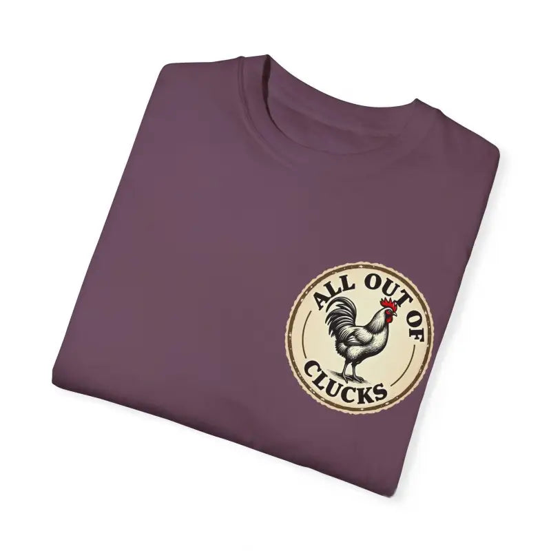 Folded purple t-shirt featuring a chicken graphic from All Out of Clucks Mens Casual T-shirt Collection