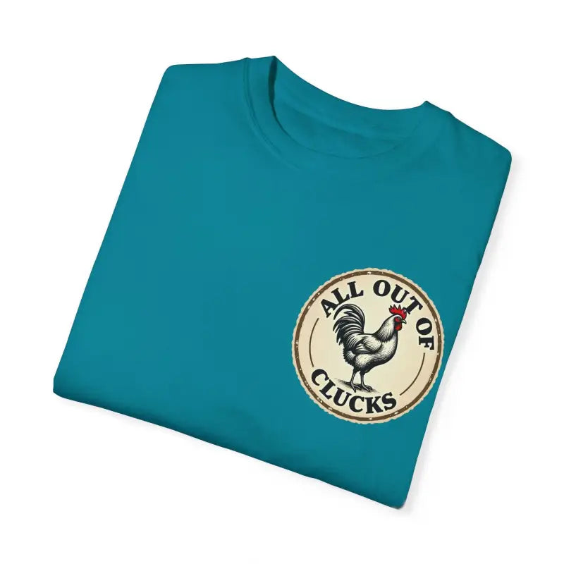 Teal T-shirt featuring chicken graphic from All Out of Clucks Men’s Casual Collection