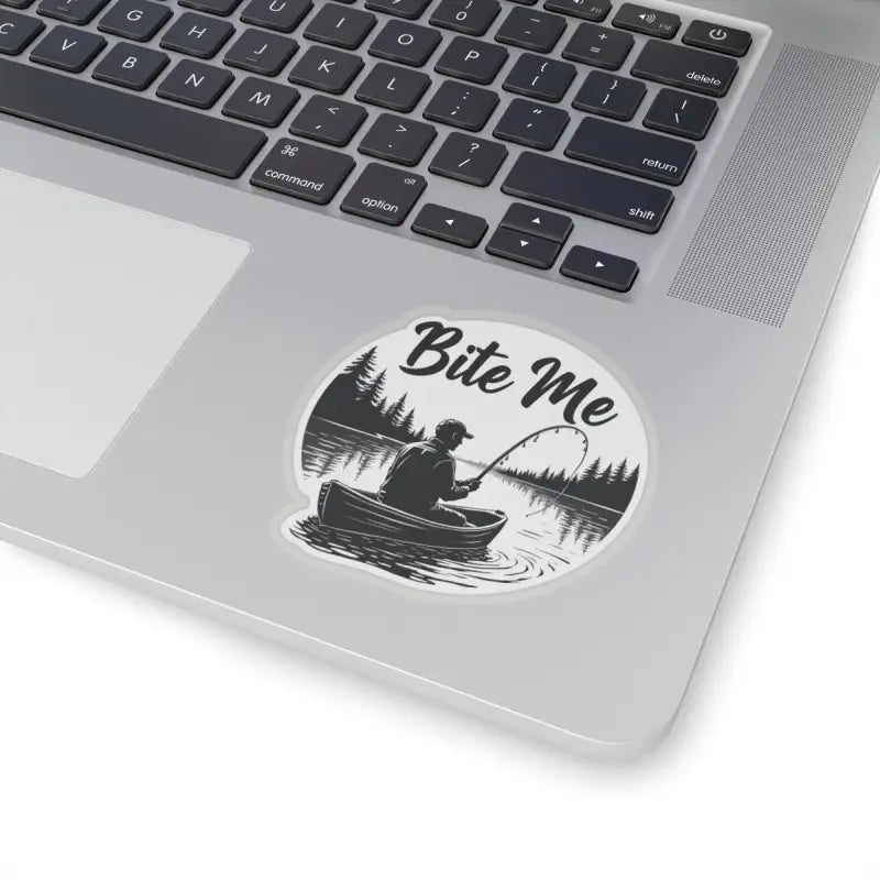 Round sticker featuring a fishing scene with a canoe for Bite Me Fishing brand