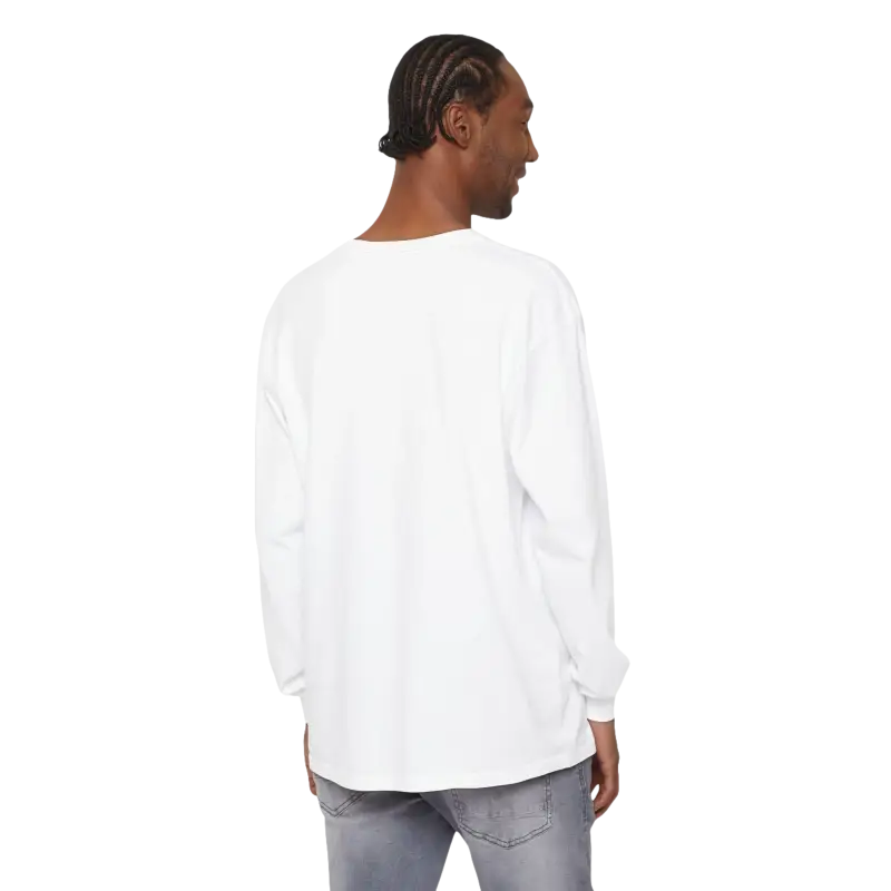 Man in white long-sleeved shirt and gray jeans wearing Block Island Long Sleeve Shirt