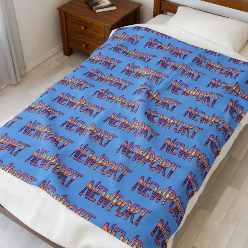 Blue blanket featuring Newport text pattern for stylish home decor