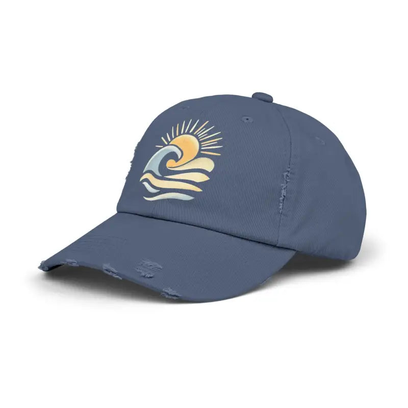 Distressed blue baseball cap featuring sun and wave design for ocean enthusiasts