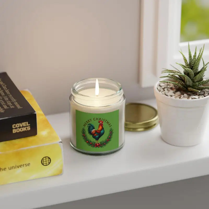 Lit Christmas Rooster Candle in Coconut Apricot Wax illuminating a festive setting