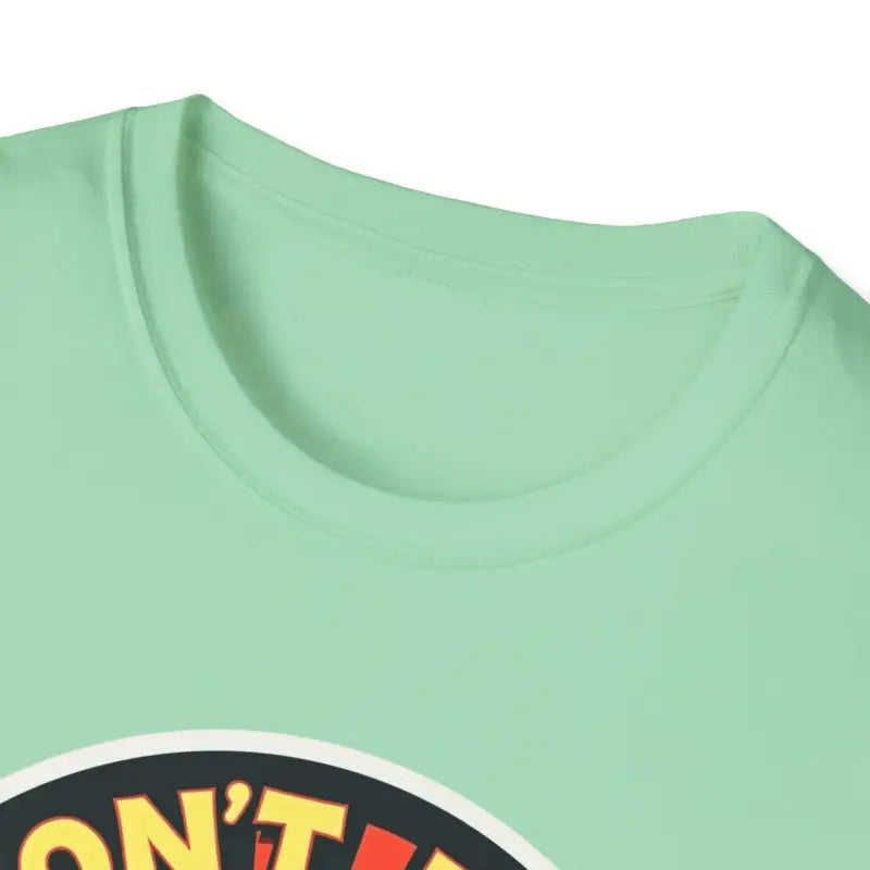 Mint green Don’t Be A Dumb Bass graphic unisex T-shirt displayed on a hanger