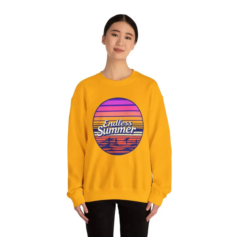 Woman in yellow Endless Summer sweatshirt, showcasing relaxed retro design and vibe