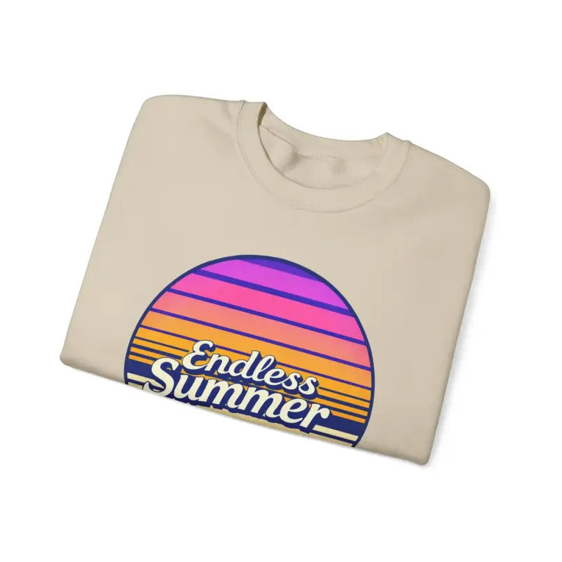 Folded beige t-shirt featuring a sunset graphic for Endless Summer Unisex Crewneck
