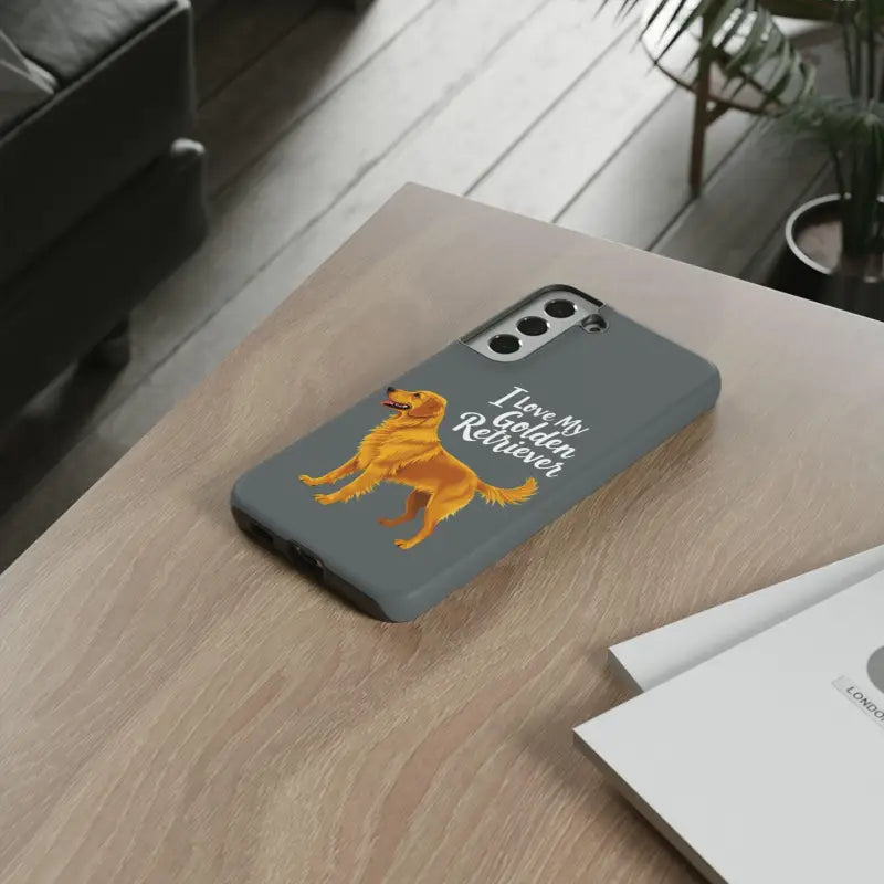 Gray phone case for iPhone 16 Pro featuring an adorable golden retriever design