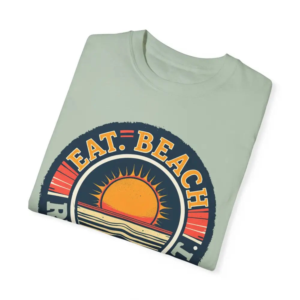Folded light green Island Reef Unisex Garment Dyed Eat Beach Relax Repeat Tee