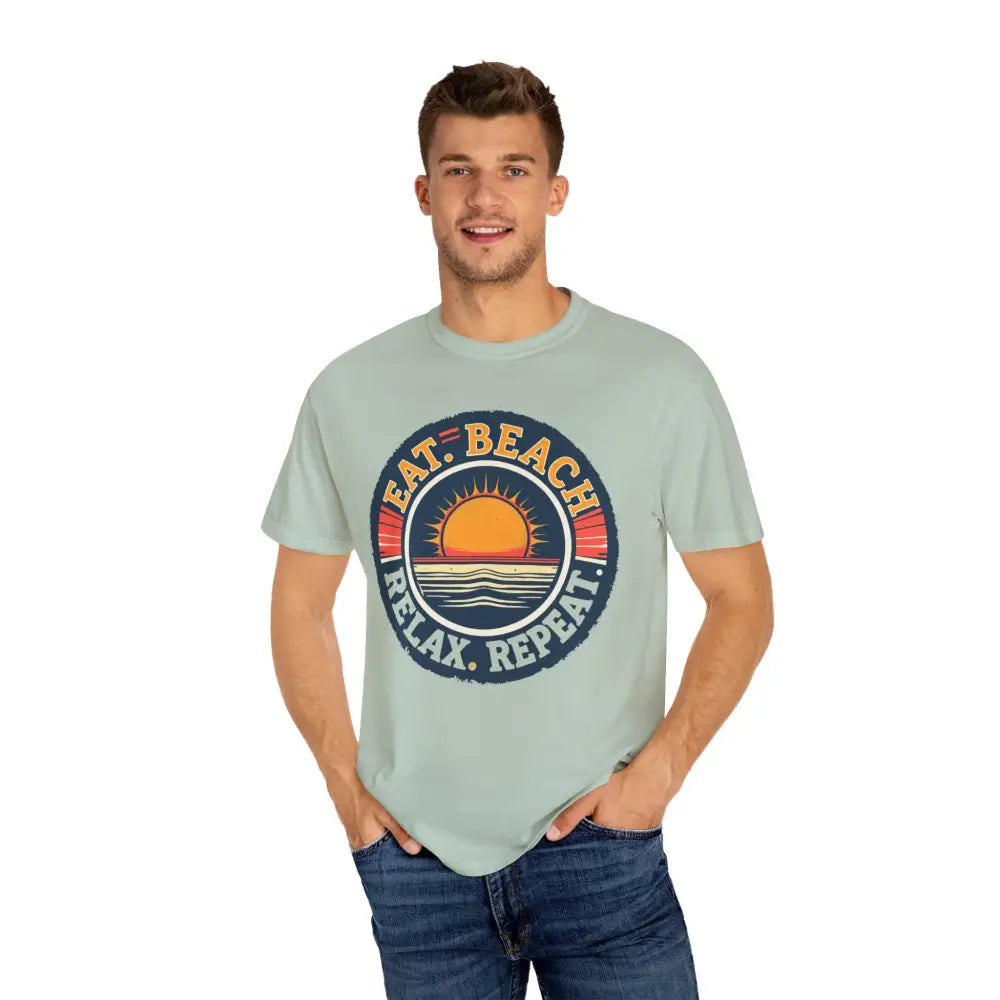 Man showcasing Island Reef Unisex Garment Dyed Eat Beach Relax Repeat Tee