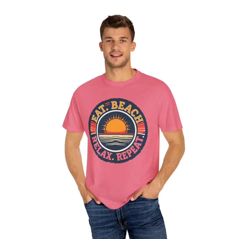 Pink t-shirt featuring a beach graphic from the Island Reef Eat Beach Relax Repeat Tee