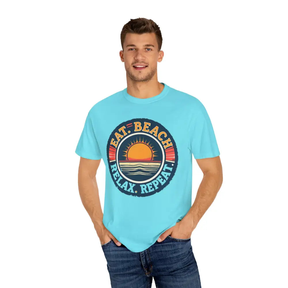 Man in a turquoise t-shirt from Island Reef Unisex Eat Beach Relax Repeat Tee