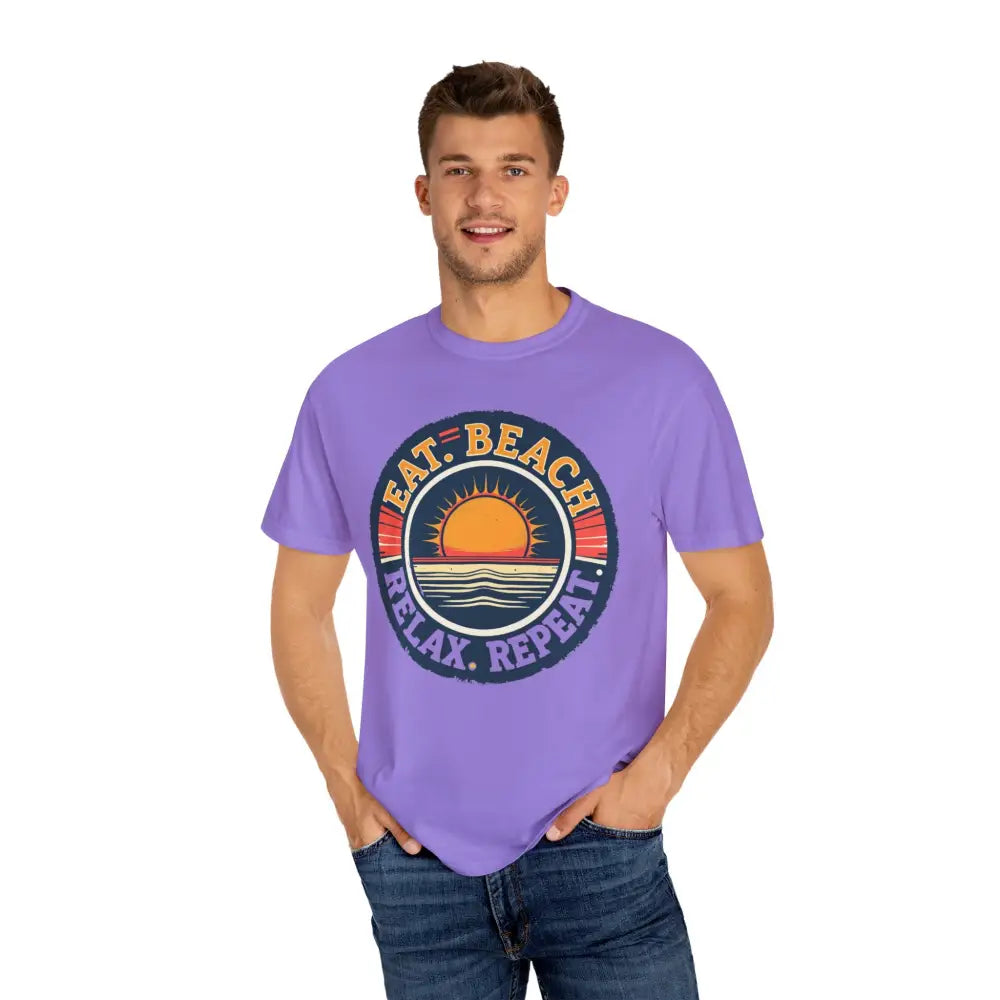 Man in a purple t-shirt showcasing the Island Reef Eat Beach Relax Repeat Tee