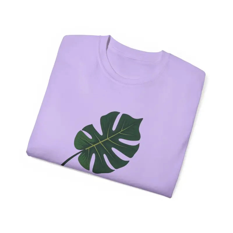Folded lavender t-shirt featuring a Monstera leaf design for plant mothers