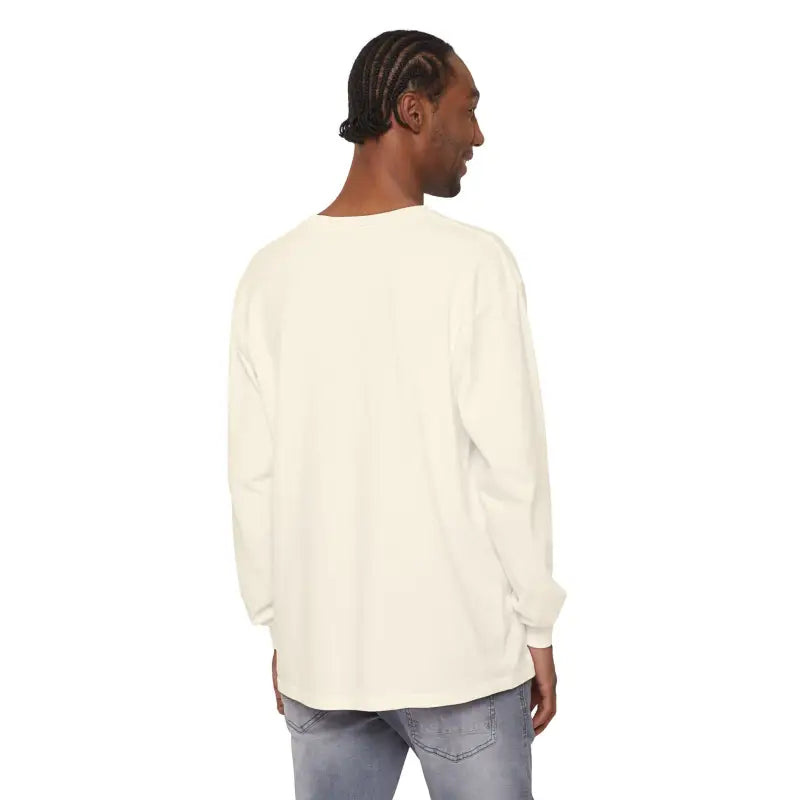 Man in yellow long-sleeved Newport graphic shirt and jeans, showcasing casual style