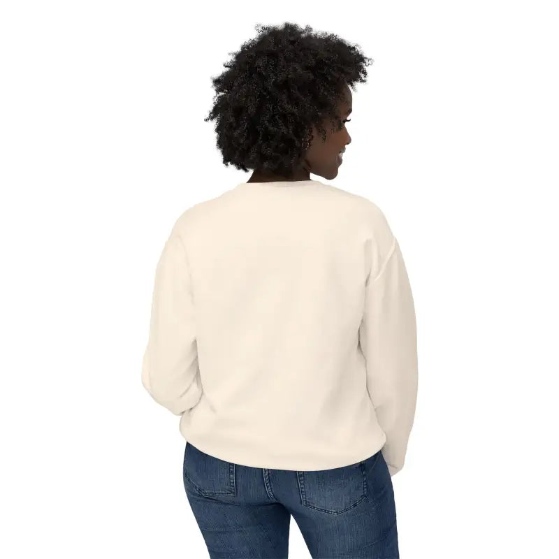 Woman in cream sweatshirt and jeans showcasing Narragansett 02882 lightweight crewneck