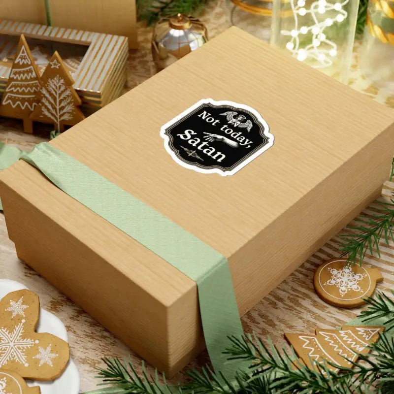 Wrapped gift box beside Not Today Satan Black Gold Religious Decorative Sign