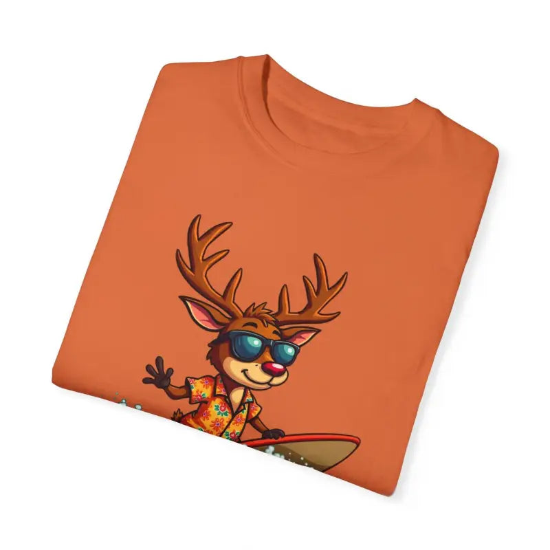 Orange T-shirt featuring a cartoon reindeer surfing design for festive style