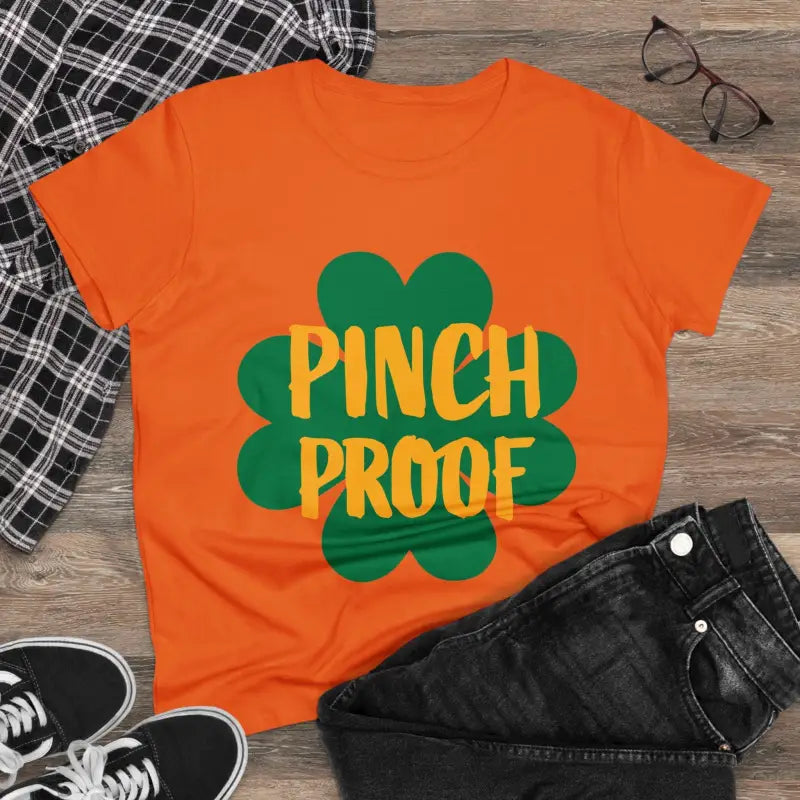 Orange t-shirt with green shamrock and Pinch Proof text for women’s cotton tee