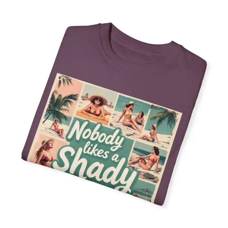 Folded purple Retro Beach Collage T Shirt featuring a vibrant beach scene graphic