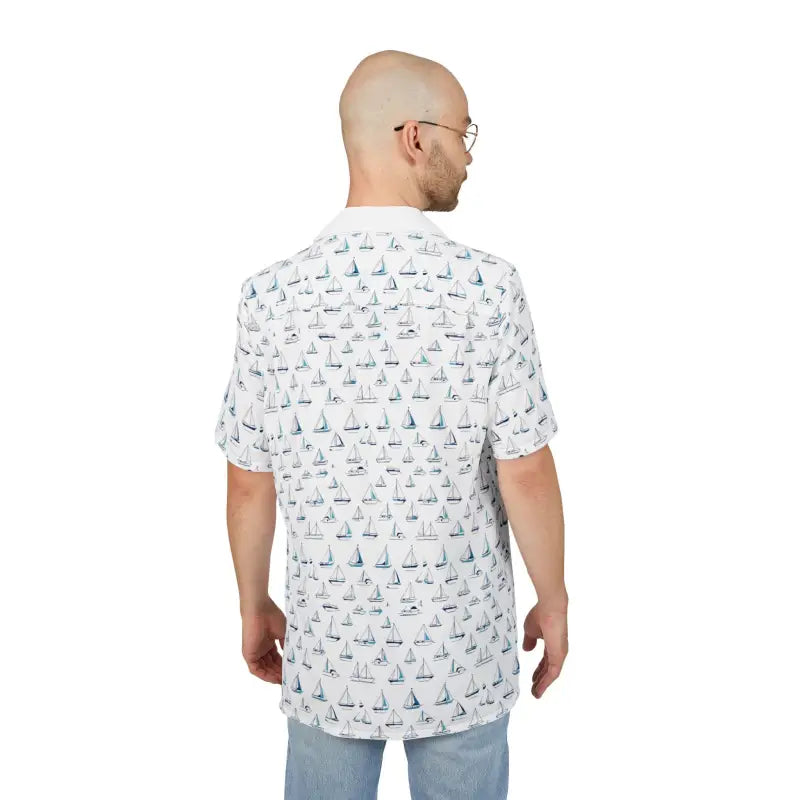 Man wearing a sailboat-patterned shirt from the Sailing Vibes Unisex Hawaiian collection