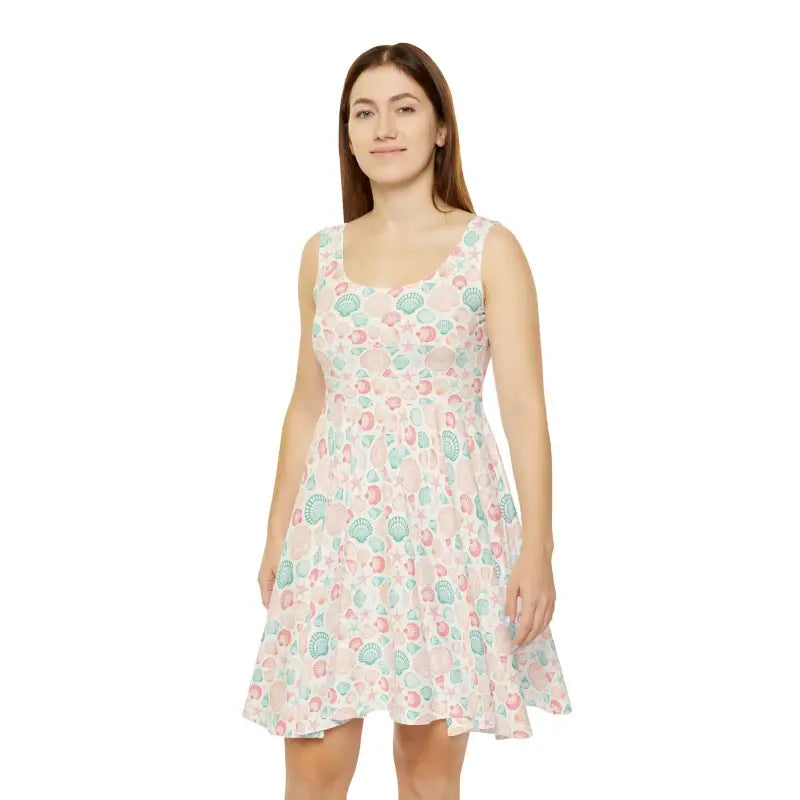 Woman in a sleeveless seashell-patterned dress for beach days and summer events