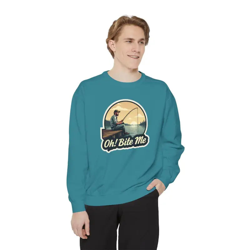 Teal sweatshirt featuring fishing graphic from Sitting on the Dock Bite Me collection