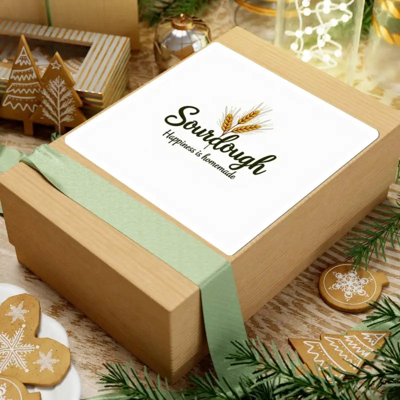 Gift box with a label beside Sourdough Bakery Sticker featuring Wheat Graphic