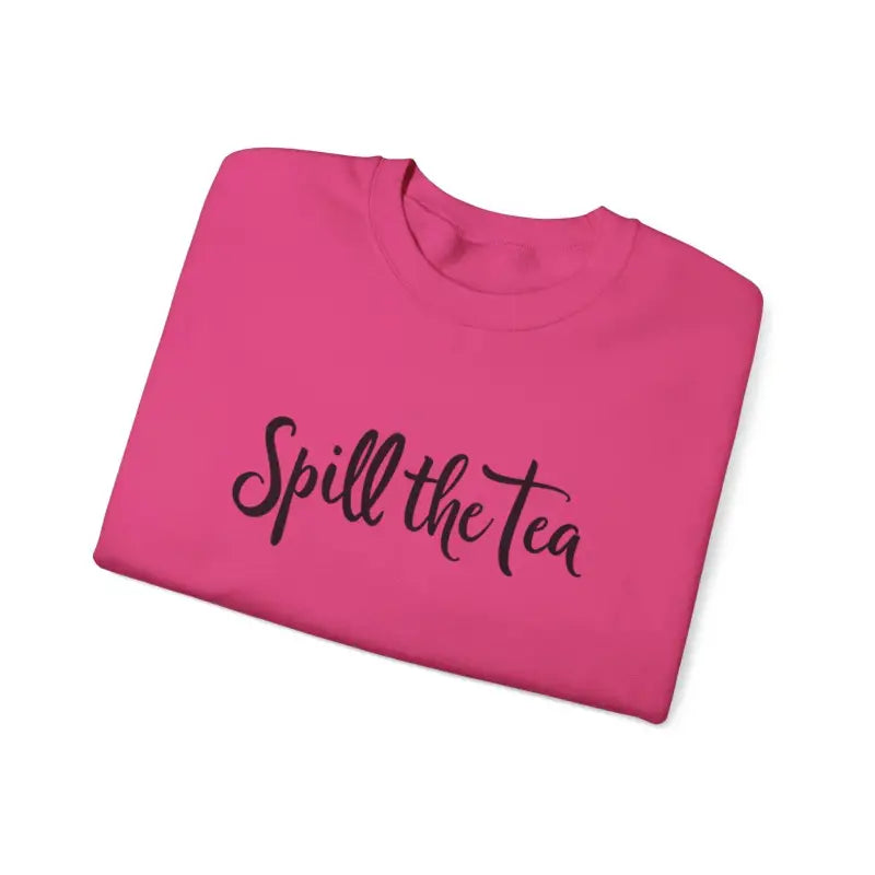 Folded pink t-shirt featured in Spill the Tea Sweatshirt for cozy casual style