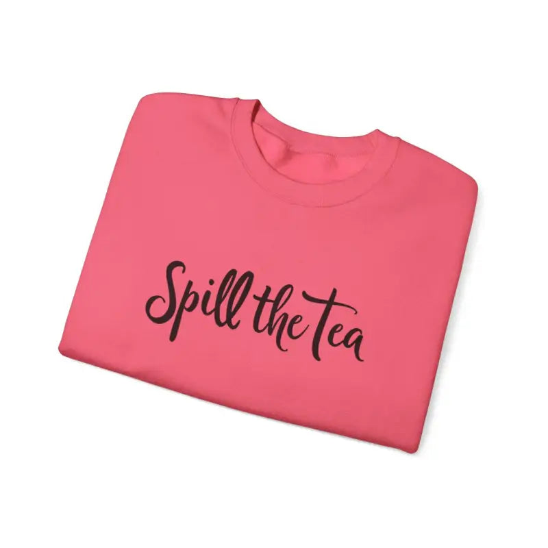 Folded pink t-shirt showcased with Spill the Tea Sweatshirt for cozy casual style