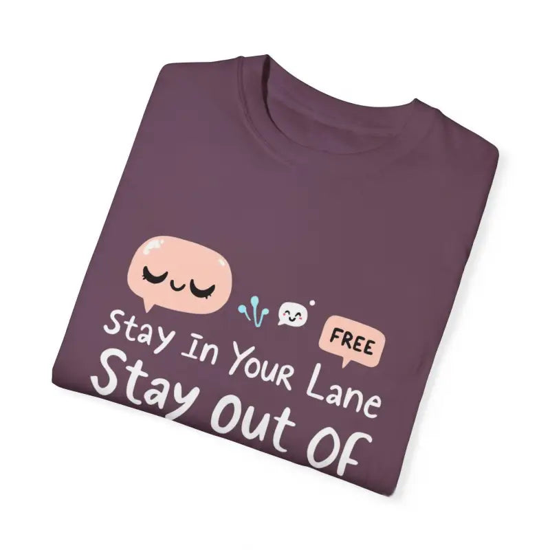 Folded purple t-shirt from Stay Out Of My Business garment dyed with cartoon graphics