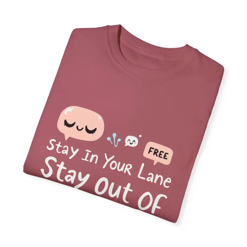 Maroon folded t-shirt featuring cartoon graphics from Stay Out Of My Business collection