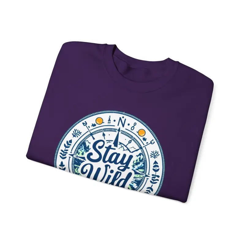 Folded purple t-shirt featuring Stay Wild design for Stay Wild Nature Explorer apparel