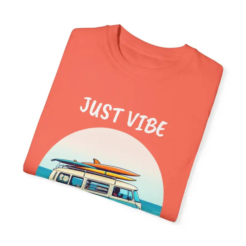 Folded orange t-shirt from Summer Vibes Unisex Garment Dyed T Shirt with Van Graphics