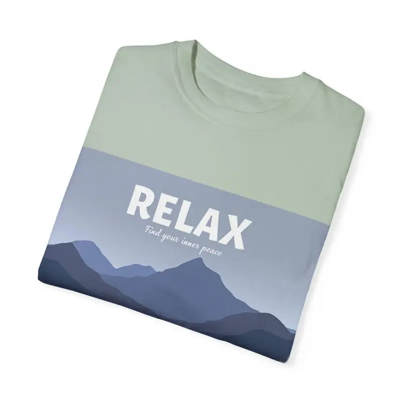Turquoise Mountain Scene Relax T Shirt featuring a folded t-shirt with mountain graphic