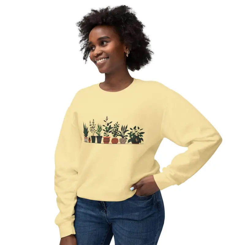 Light yellow unisex sweatshirt featuring a charming potted plant design
