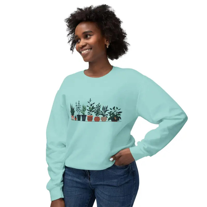 Light blue unisex sweatshirt featuring a stylish potted plant design on front
