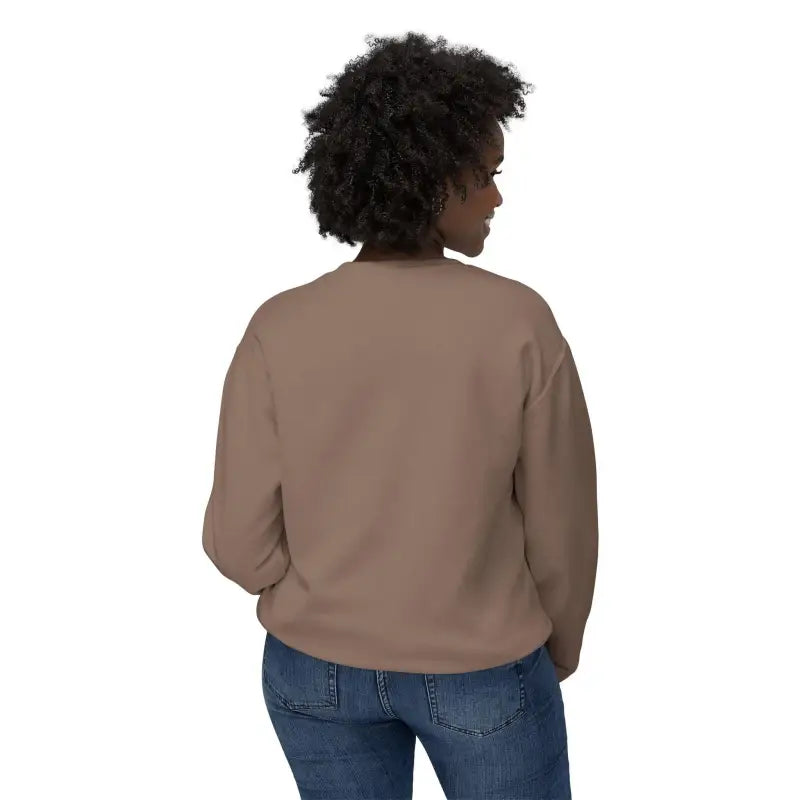 Woman wearing a brown sweatshirt and jeans, featuring a Potted Plant design