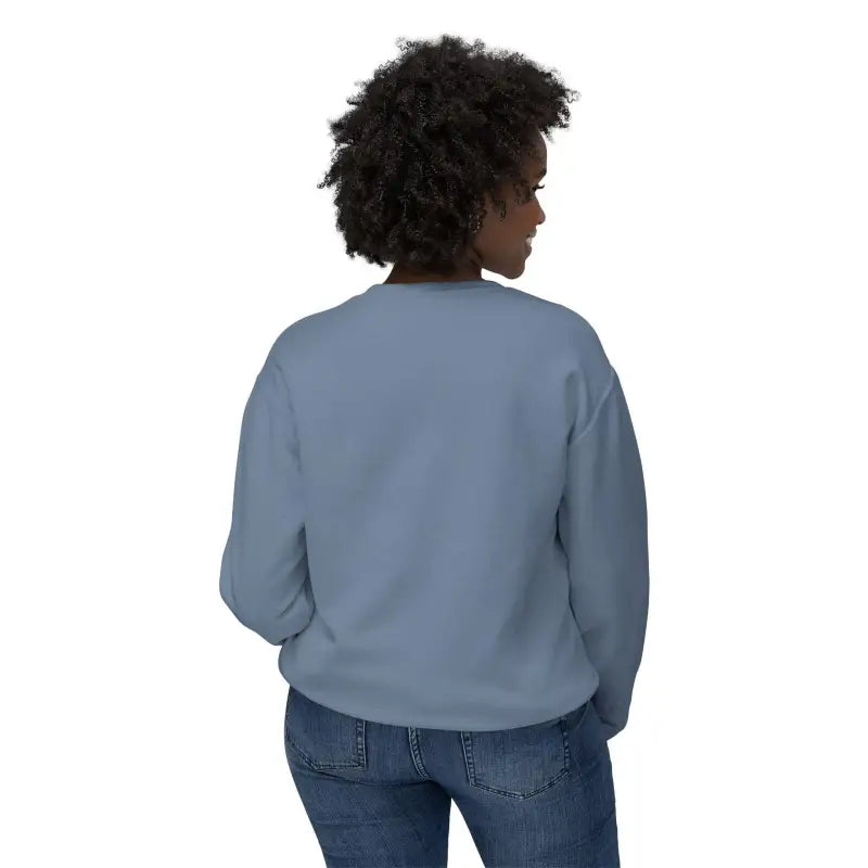 Woman in blue sweatshirt and jeans showcasing Unisex Lightweight Crewneck Sweatshirt