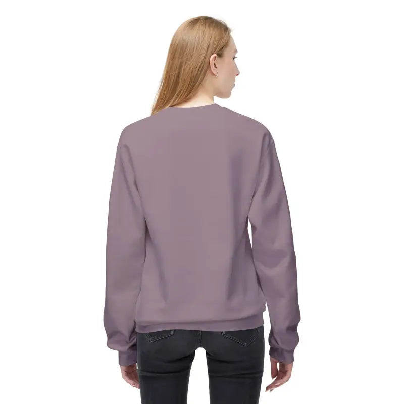 Woman wearing a mauve sweatshirt from the Women’s Floral Sweatshirt Softstyle Fleece line
