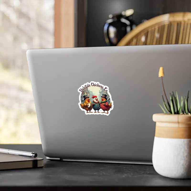 Laptop featuring Yuletide Chickens Co Christmas vinyl decal of three festive chickens