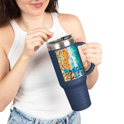 Navy blue travel mug featuring an insulated design and a beach scene