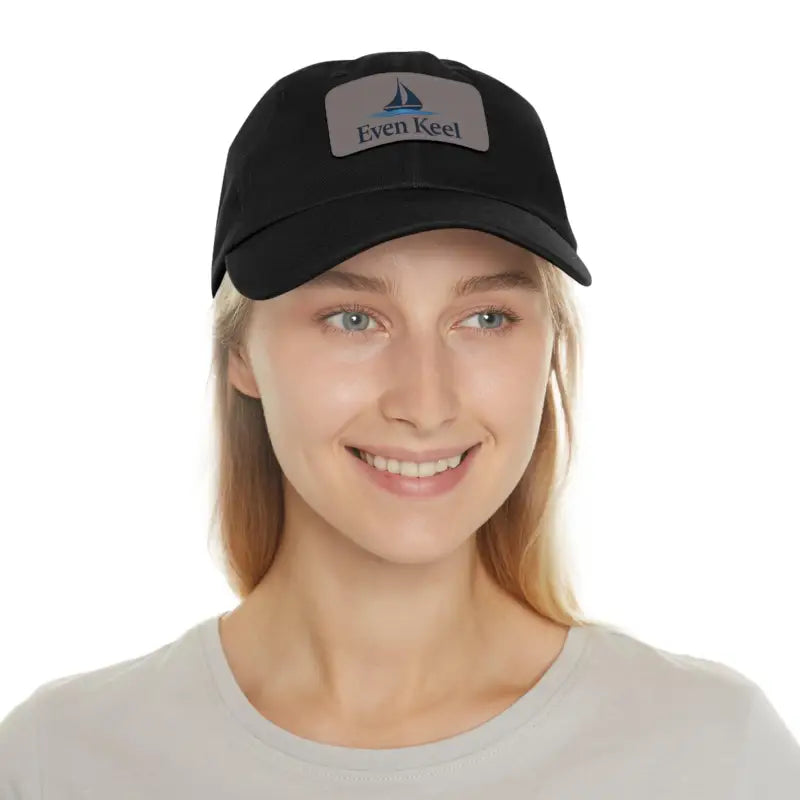 Black Even Keel Dad Hat featuring a notable sailboat patch design