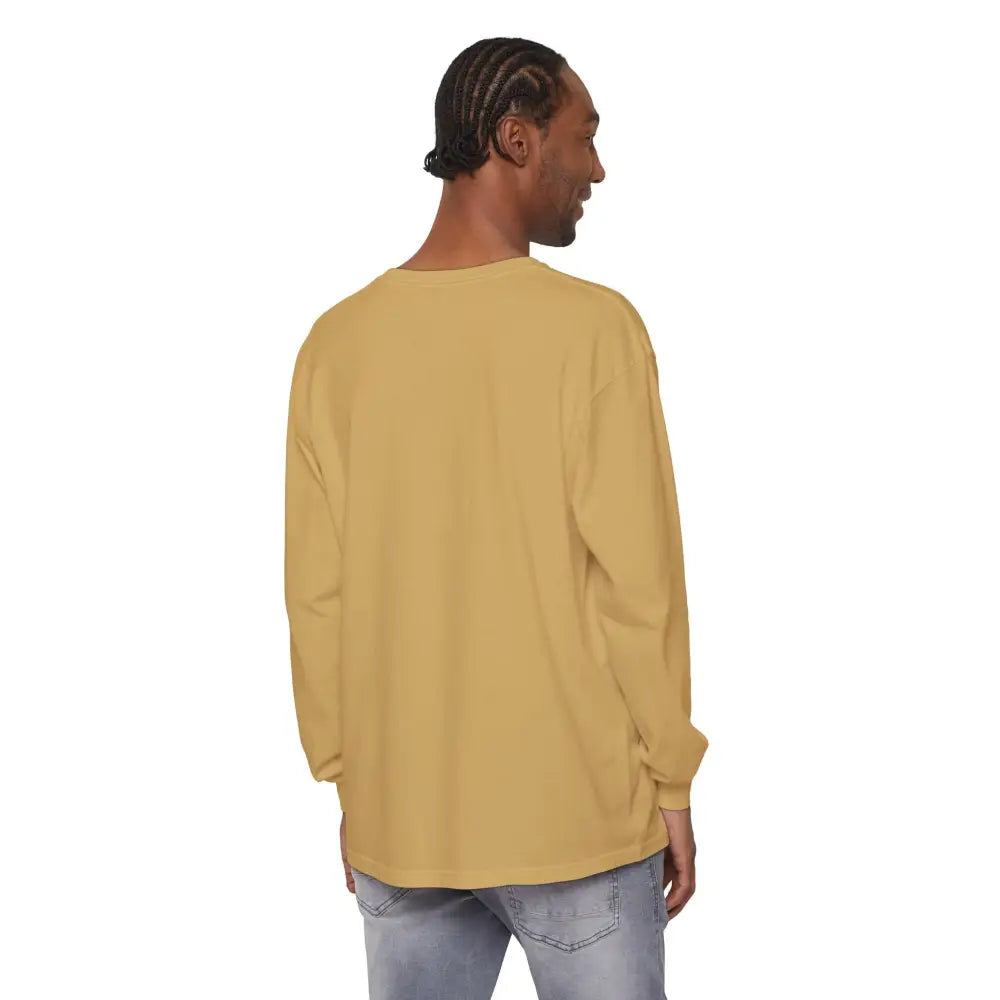 Person modeling BLOCK ISLAND Unisex Long Sleeve Tee in a stylish outdoor setting
