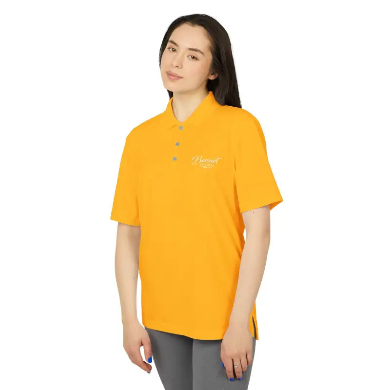Woman’s yellow polo shirt from Bonnet Shores Embroidered Adidas Sport Shirt collection