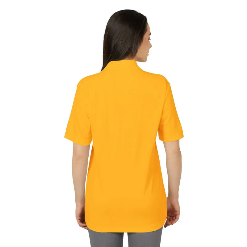 Woman wearing a yellow short-sleeved Bonnet Shores Embroidered Adidas Polo Sport Shirt