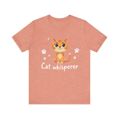Salmon-colored Cat Whisperer Unisex Short Sleeve Tee featuring a cartoon cat design