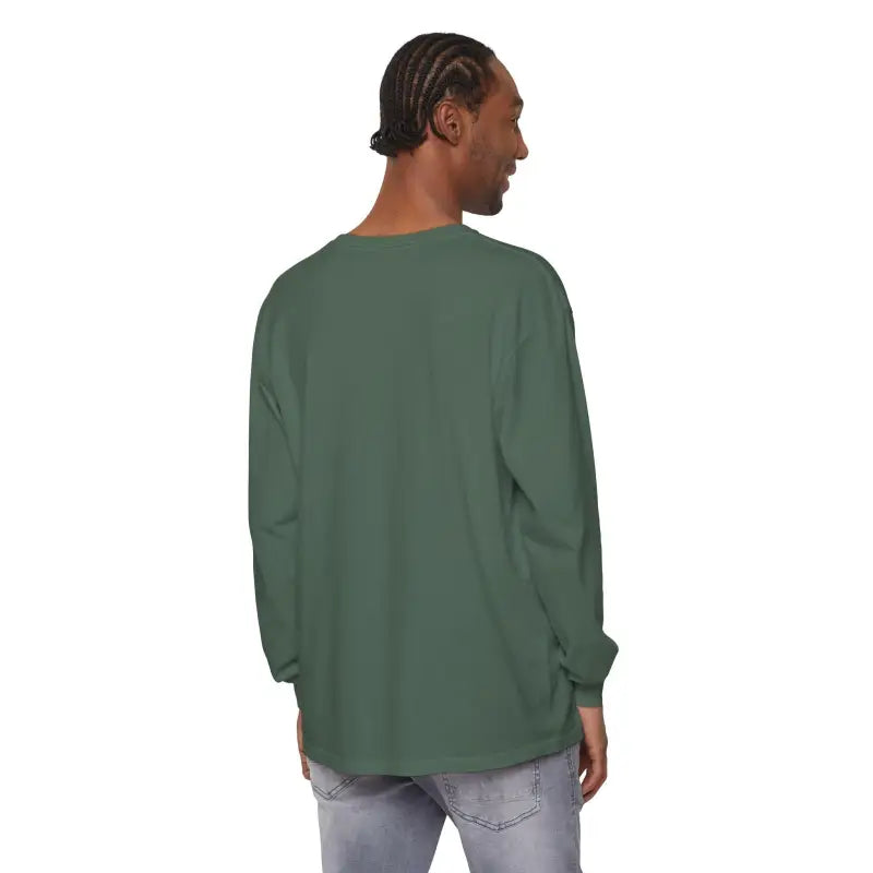 Man wearing a green long-sleeved Christmas Filthy Duck shirt