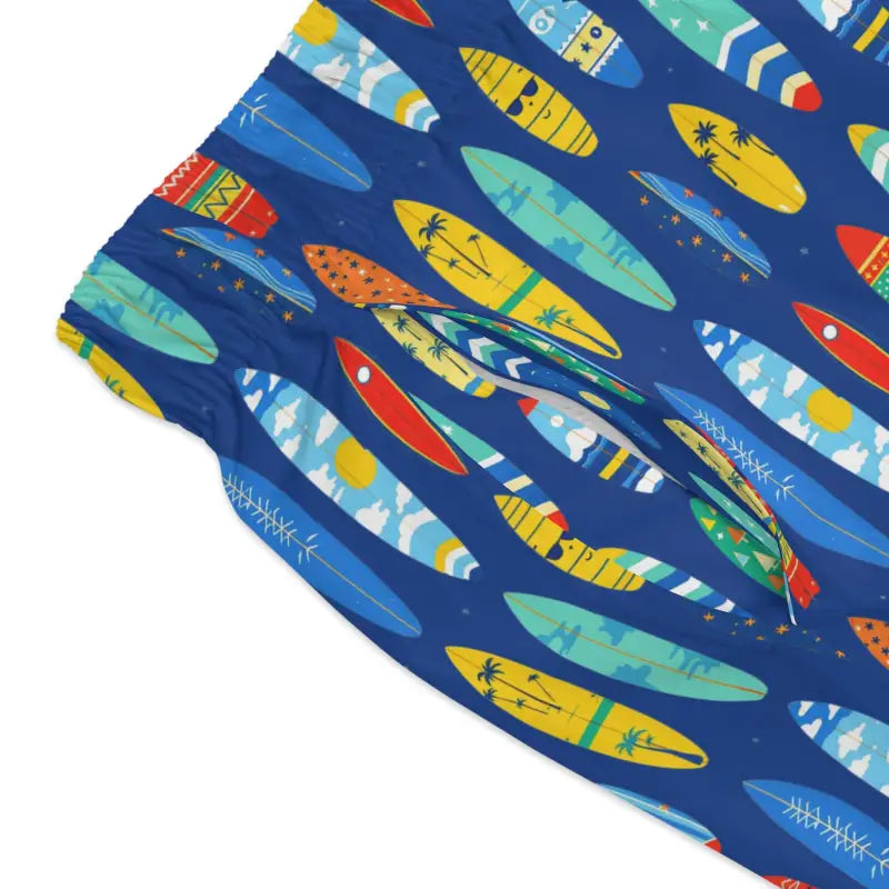 Blue swim trunks with a surfboard pattern for beach days and summer fun
