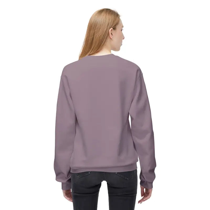 Woman in a mauve sweatshirt from the Cozy Block Island Lighthouse Sweatshirt collection